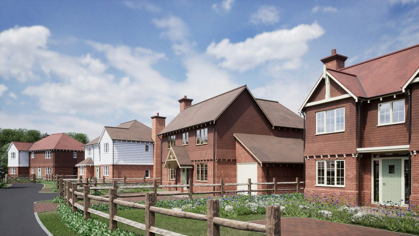 Street of new-build homes in red facing brick